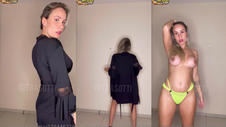 Tuani Basotti fazendo um striptease